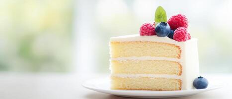 Delicious homemade cake slice on elegant plate, featuring layers of soft sponge, creamy frosting, and topped with fresh raspberries and blueberries, perfect for any occasion photo