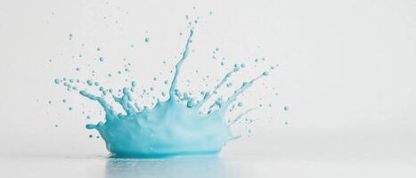 High speed photo of blue water splash creating droplets in mid air, showcasing dynamic movement and vibrant color. Perfect for artistic and creative projects