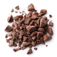 Rich cocoa nibs scattered on white background, perfect for chocolate lovers and baking enthusiasts. These raw chocolate ingredients add depth to desserts and snacks photo