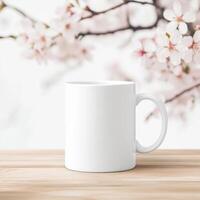 bright white blank mug on wooden table with cherry blossom flowers in background creates serene and inviting atmosphere. Perfect for showcasing your favorite beverage photo