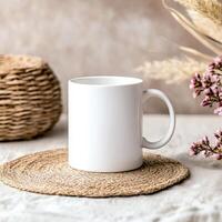 simple white mug placed on woven mat, surrounded by natural decor elements, creating cozy and inviting atmosphere photo