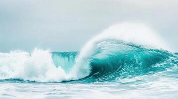beautiful wave crashes gracefully against ocean surface, showcasing vibrant turquoise hues and frothy white foam. serene atmosphere evokes sense of calm and tranquility photo