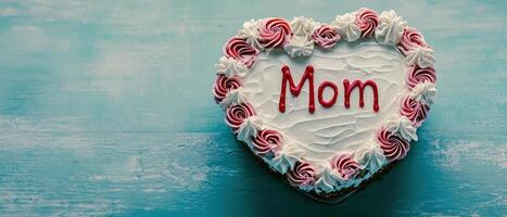 beautiful heart shaped cake adorned with pink and white frosting celebrates love for mothers on this special day photo