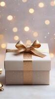 beautiful gift box wrapped in gold ribbon symbolizes happy anniversary and is perfect for any work celebration or business event photo