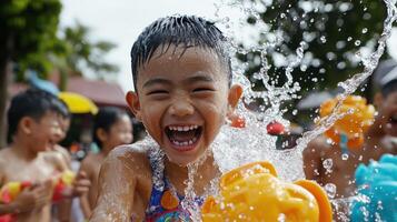 Happy child playing in water with friends during summer fun, splashing joyfully photo