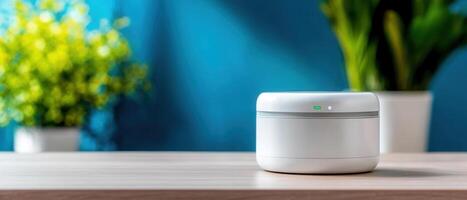 A small white air purifier sits on a table photo