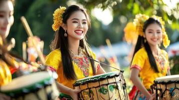 Traditional Thai music performance during Songkran festival, showcasing vibrant costumes and joyful expressions photo