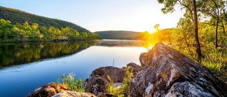 serene river view at twilight with soft water reflections and vibrant greenery photo