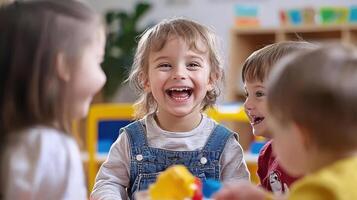 A group of children laughing and playing in a classroom photo