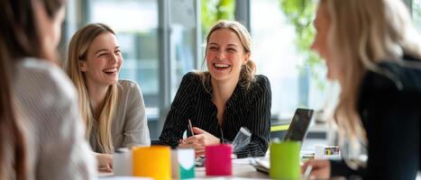 Empowered women collaborating and sharing ideas in bright office photo