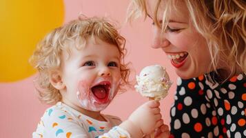 A woman holding a child with an ice cream cone photo