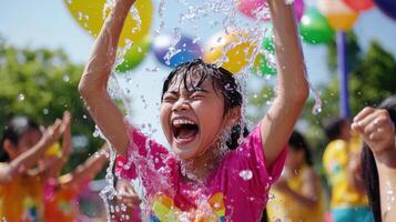 A young girl is splashing water on her face photo