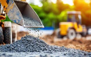 Construction equipment and concrete being poured into a bucket photo