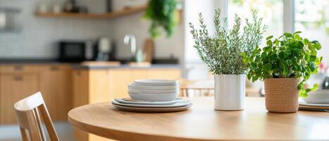 A kitchen table with dishes and a plant photo
