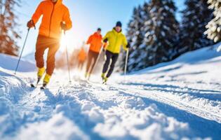 Three people cross country skiing on a sunny day photo