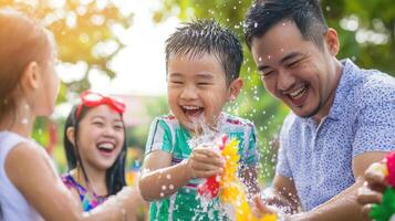 Family gathering during Songkran Festival, enjoying water play and laughter. joy and excitement are palpable this vibrant photo