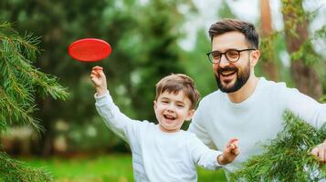 Playful father and son enjoying day outdoors with frisbee in nature photo