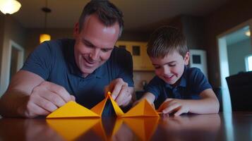 Father and son making origami boats photo
