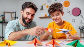 Father and son crafting colorful paper airplanes at dining table, enjoying quality time together photo