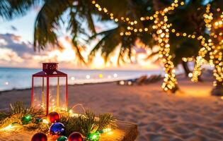 festive lantern surrounded by ornaments and greenery on beach at sunset, with twinkling lights in background photo