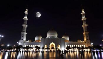 Sheikh Zayed Mosque at Night with Moon and Reflections in Abu Dhabi photo