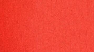 Red colored paper texture background with detailed surface photo