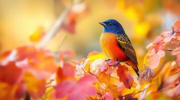 A bird is perched on a tree branch with leaves falling around it photo