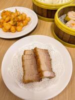 A table with two plates of food and a bowl of rice photo