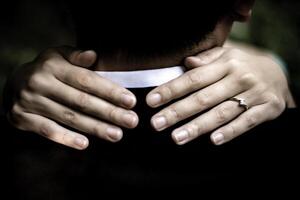 Romantic embrace with hands and a ring, a symbol of love and connection photo