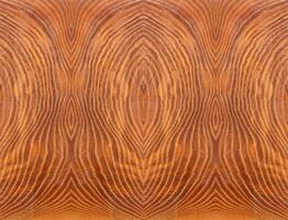 background is pattern with a wood texture on brown slice. Stabilized wood photo