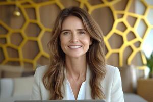 Professional woman smiling at desk in modern office with unique decor and warm ambiance photo