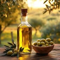 Golden olive oil stands in a glass bottle with a cork next to a wooden bowl of fresh olives, bathed in the warm glow of sunset light in an olive grove photo