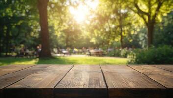 Rustic wooden surface backlit by sunlight, casting soft shadows over blurred park scenery photo