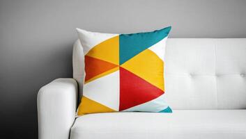 Decorative pillows with geometric patterns on a white sofa photo