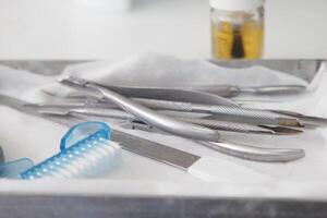 Surgical instruments arranged on a tray in a medical setting photo