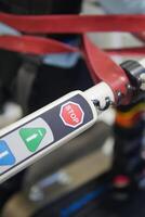 Control panel of a mobility device showing stop button and icons photo