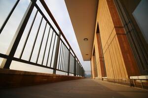 View from a modern balcony overlooking a scenic landscape at dusk photo