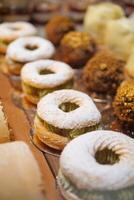 Delicious pastries displayed at a bakery during afternoon hours photo