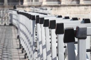 Railing along a scenic walkway in a historic city photo