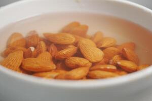 Soaking almonds to enhance flavor and texture in culinary preparation photo