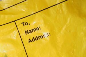 Yellow envelope with address fields ready for delivery photo