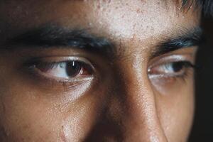 Close-up of a person's eyes reflecting deep emotion and thought photo