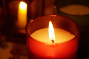 Warm glow from candles illuminating a cozy indoor setting photo