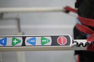 Control panel with stop and navigation buttons in use at facility photo