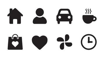 A set of black and white icons including a coffee cup, clock, and a heart vector