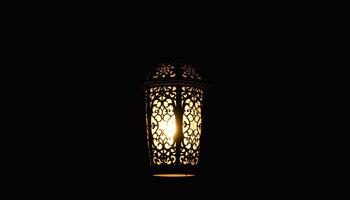 a lamp with a light shining through it photo
