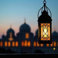 a lantern is lit up in front of a mosque photo