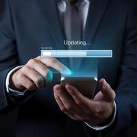 Businessman using smartphone to update website photo
