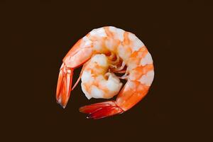 A shrimp is shown on a brown background photo