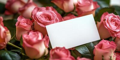 Romantic floral arrangement with roses and blank card for love notes or invitations photo